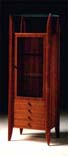 
      Mobile vetrina in teak con quattro cassetti.
      Teak-wood cupboard with four drawers.
      cm. 64x50 h 190
      