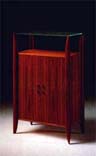 
      Mobile contenitore in tek 4 ante.
      Teak-wood cabinet.
      cm. 89x50 h 140
      